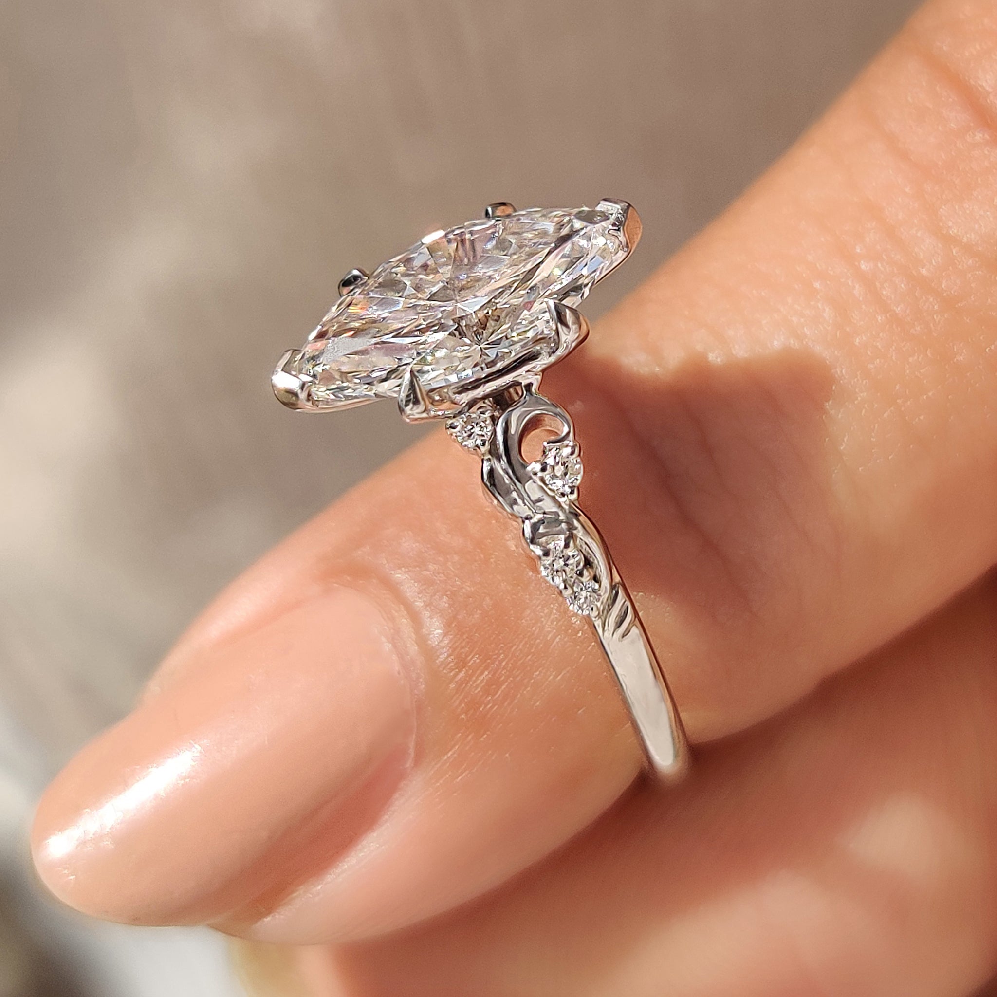 Marquise Cut Diamond Ring in Side Stone Style