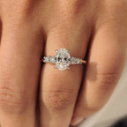 Oval Cut Diamond Ring with Round Side Stones
