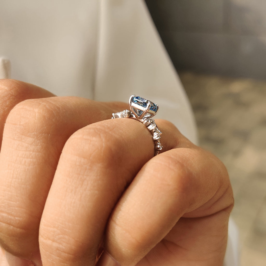 Blue Cushion Cut Diamond Ring in Cluster Setting