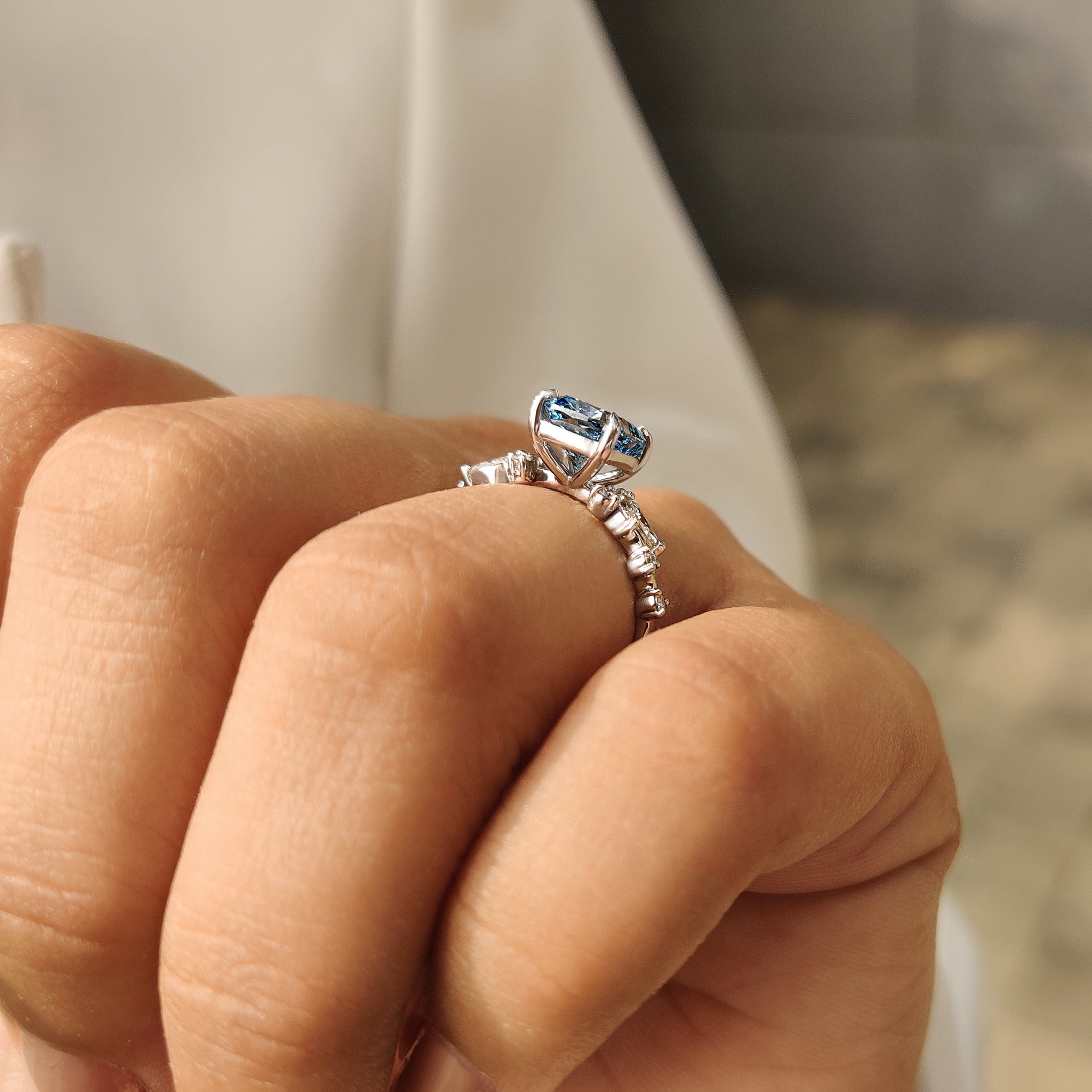 Blue Cushion Cut Diamond Ring in Cluster Setting