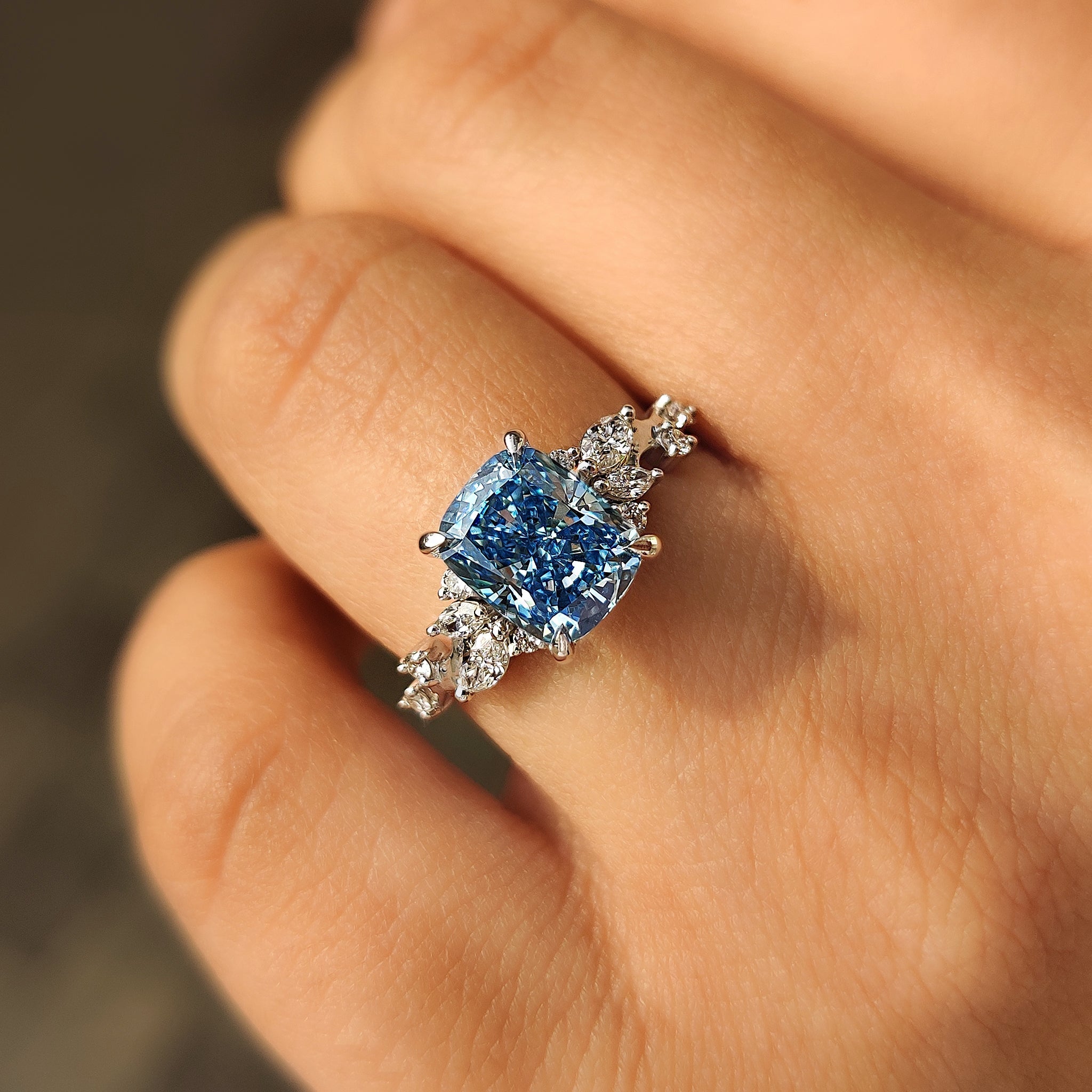 Blue Cushion Cut Diamond Ring in Cluster Setting