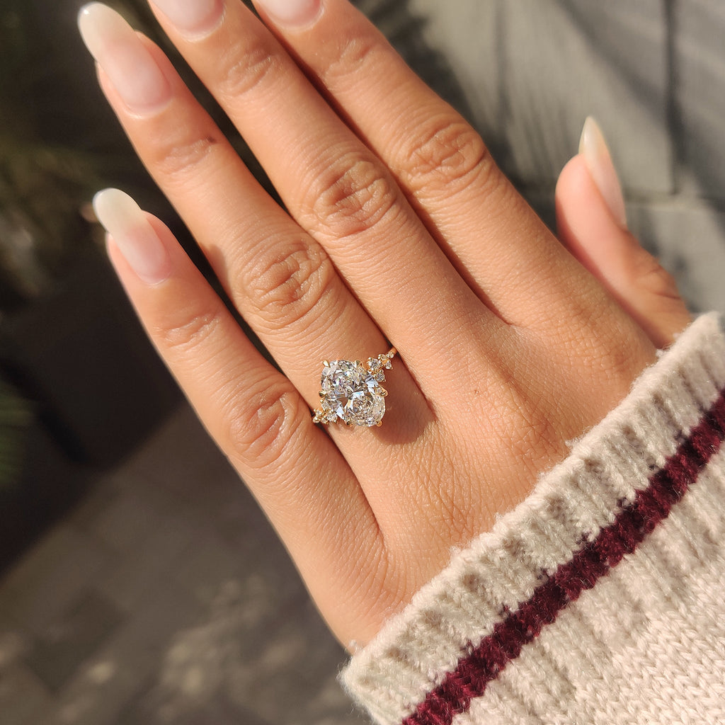 Oval Diamond Ring With Round Side Stones