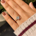 Three Stone Style Oval Cut Engagement Ring with Round Side Stone