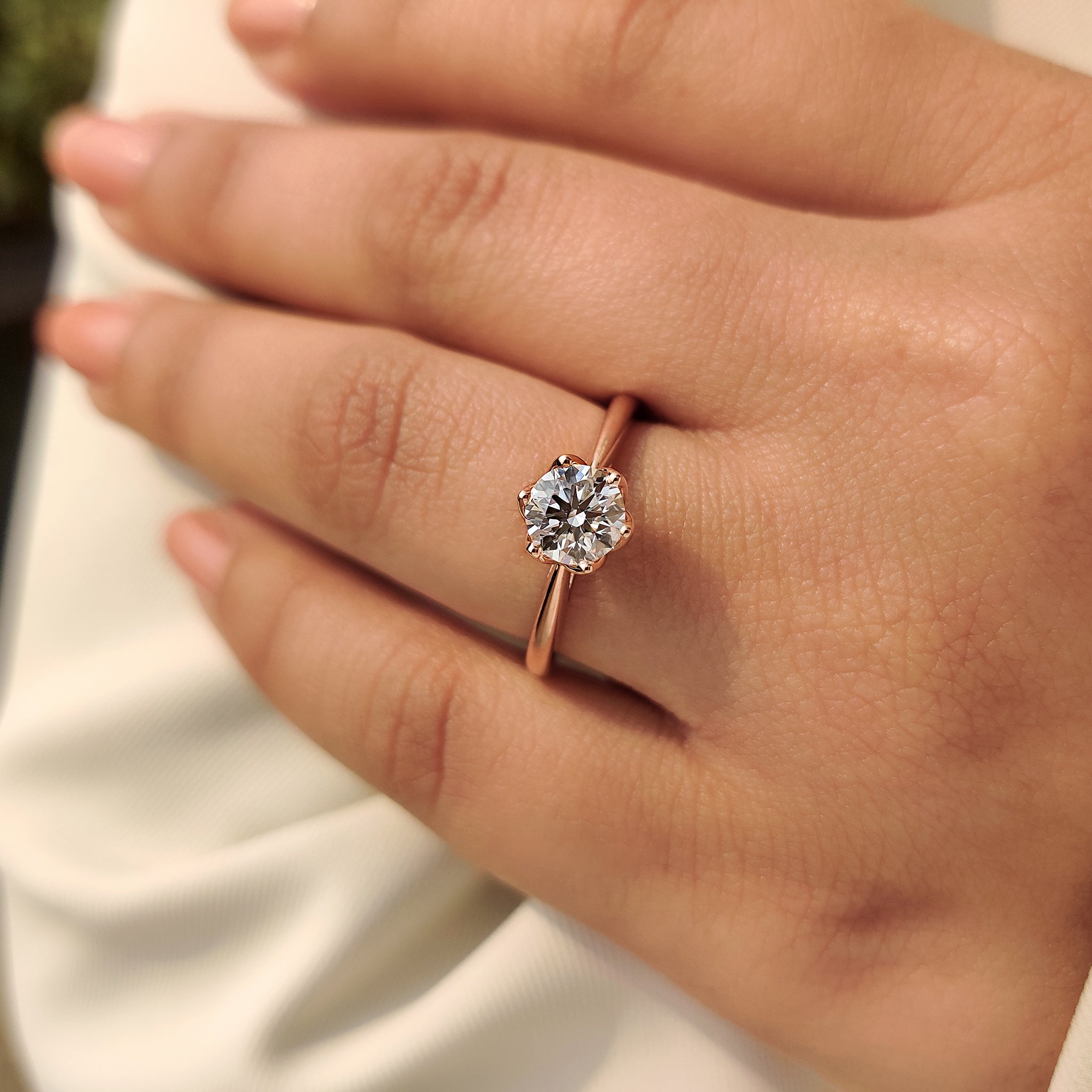 Solitaire Style Round Cut Diamond Ring with Hidden Blue Sapphire