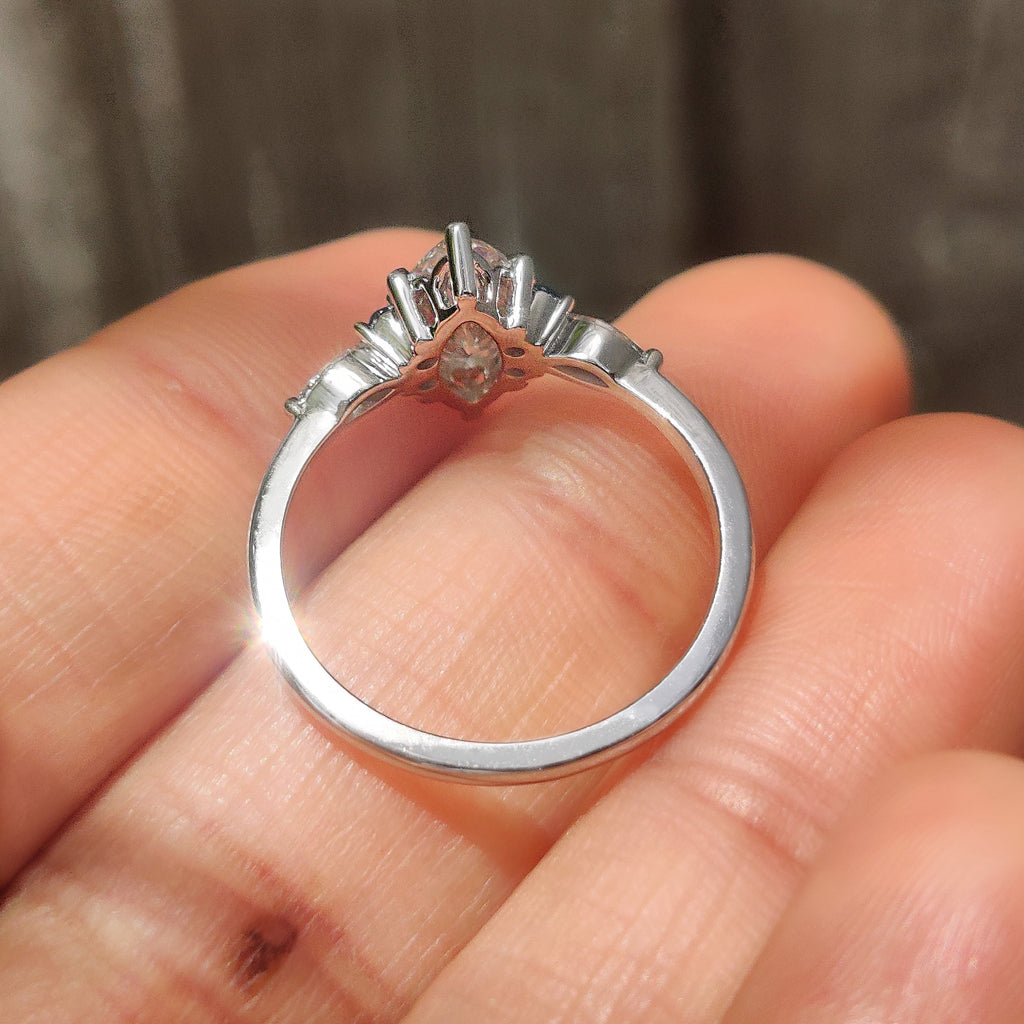 Marquise Cut Engagement Ring With Blue Sapphire Side Stone Style
