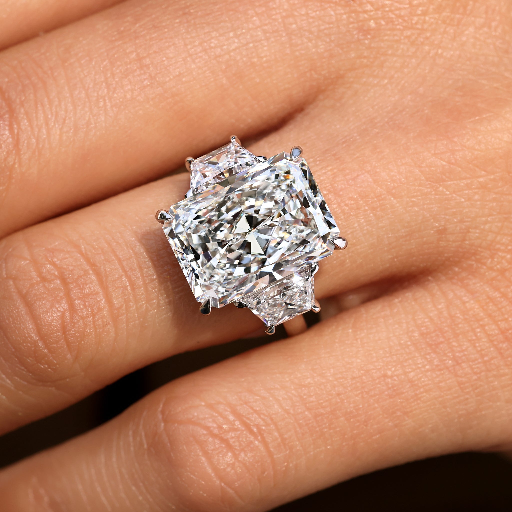 10 - 14 Carat Radiant Cut Diamond Ring with Trapezoid Side Stones