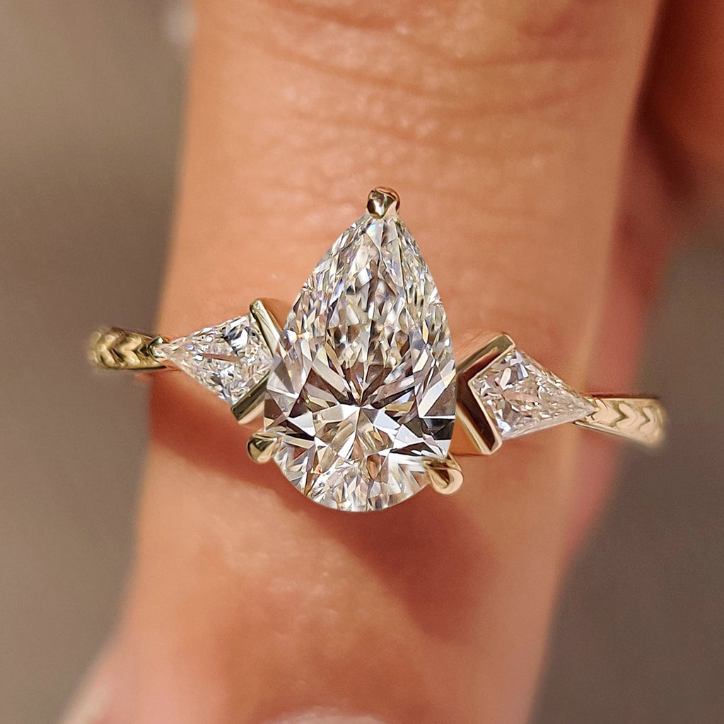 Pear and Kite Cut Three Diamond Ring with Art Deco Band