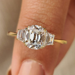 Old Mine Cushion Cut Diamond Ring with Trapezoid Side Stones