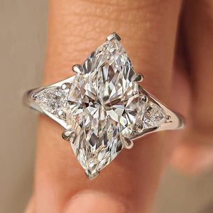 Three Stone Marquise Diamond Ring with Pear Side Diamond