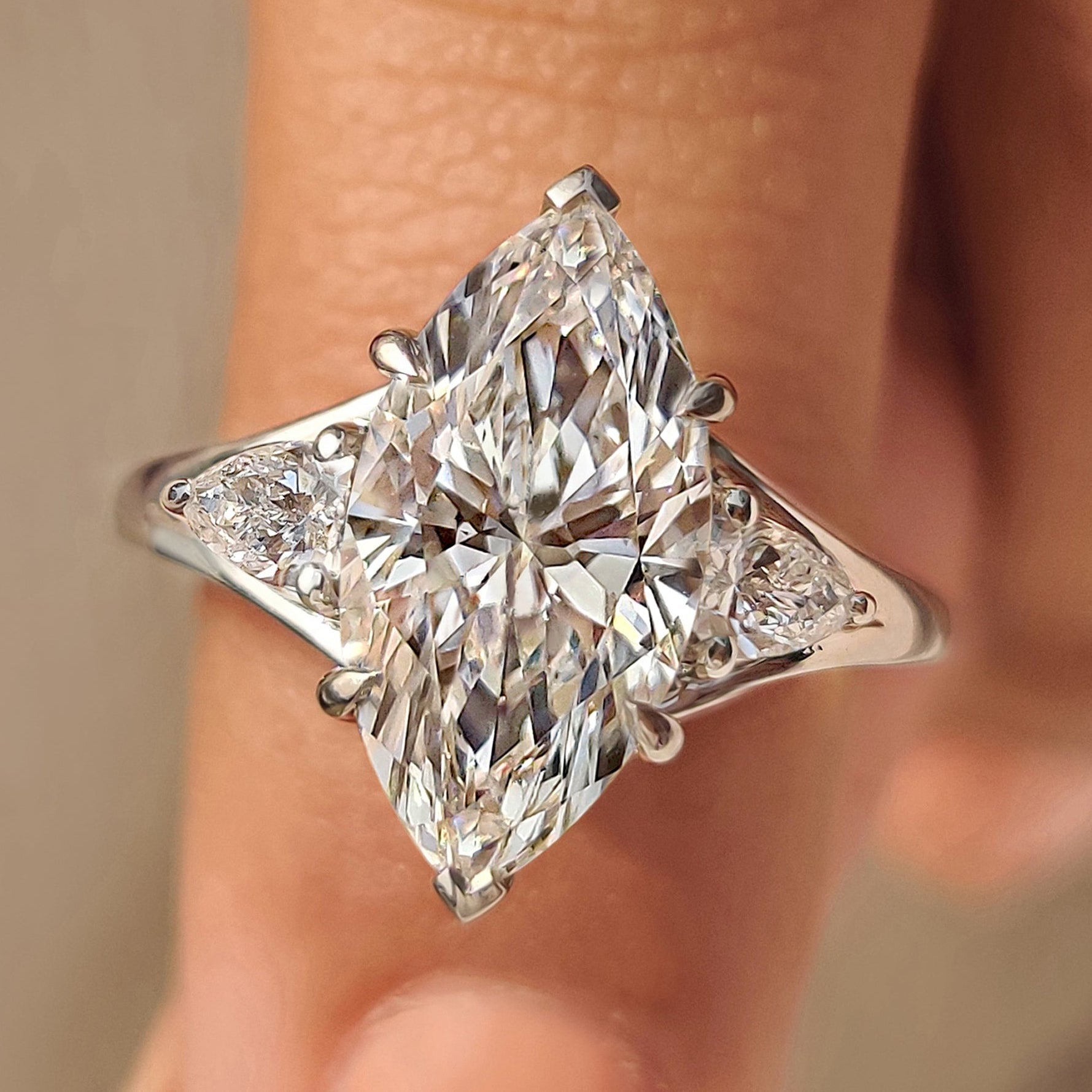 Three Stone Marquise Diamond Ring with Pear Side Diamond
