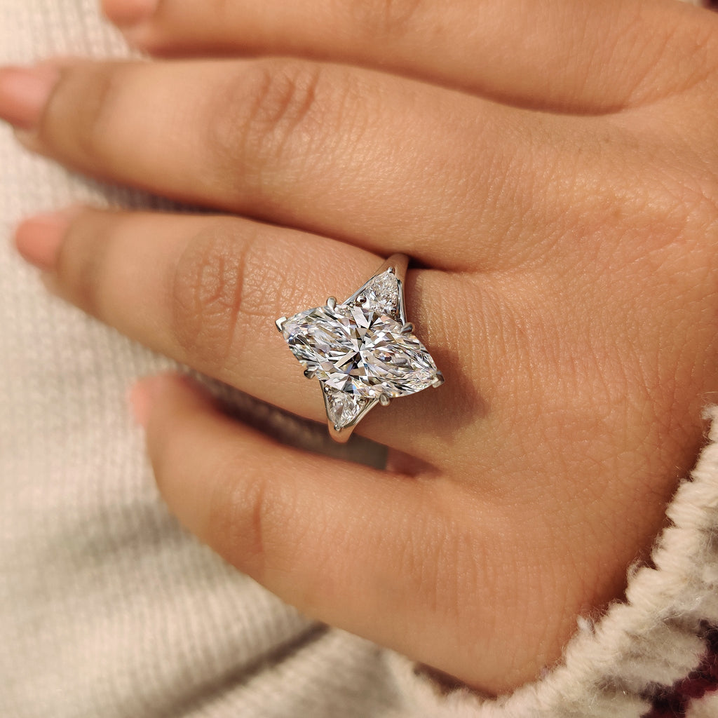 Three Stone Marquise Diamond Ring with Pear Side Diamond