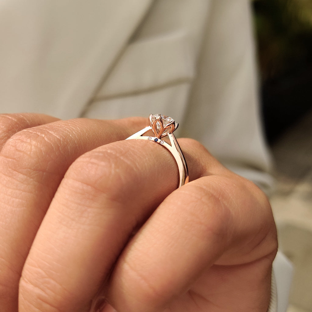Solitaire Style Round Cut Diamond Ring with Hidden Blue Sapphire