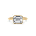 Bezel Emerald Cut Engagement Ring In Yellow Gold