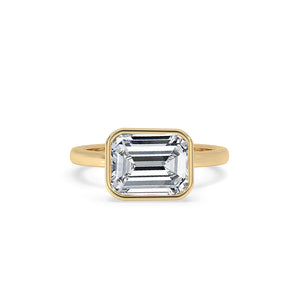 Bezel Emerald Cut Engagement Ring In Yellow Gold