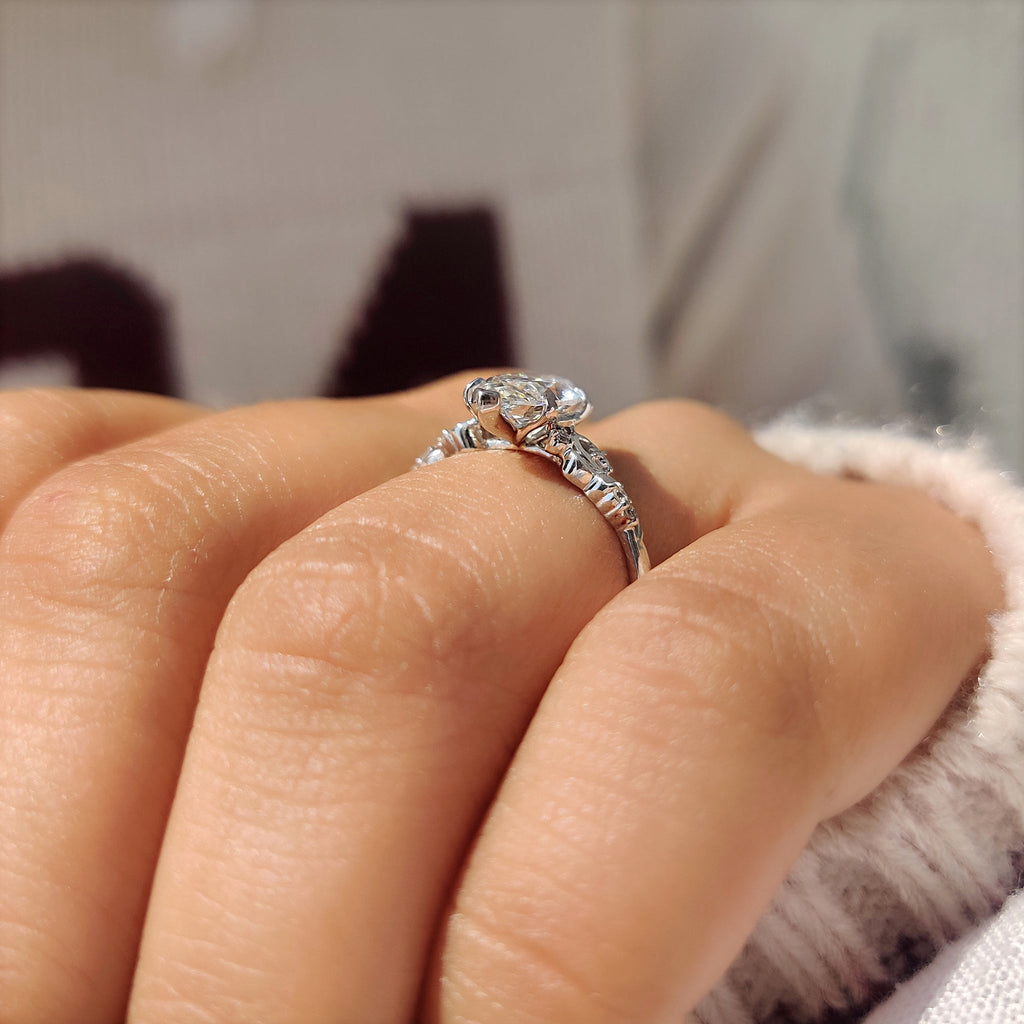 Marquise Cut Diamond Ring in Side Stone Style