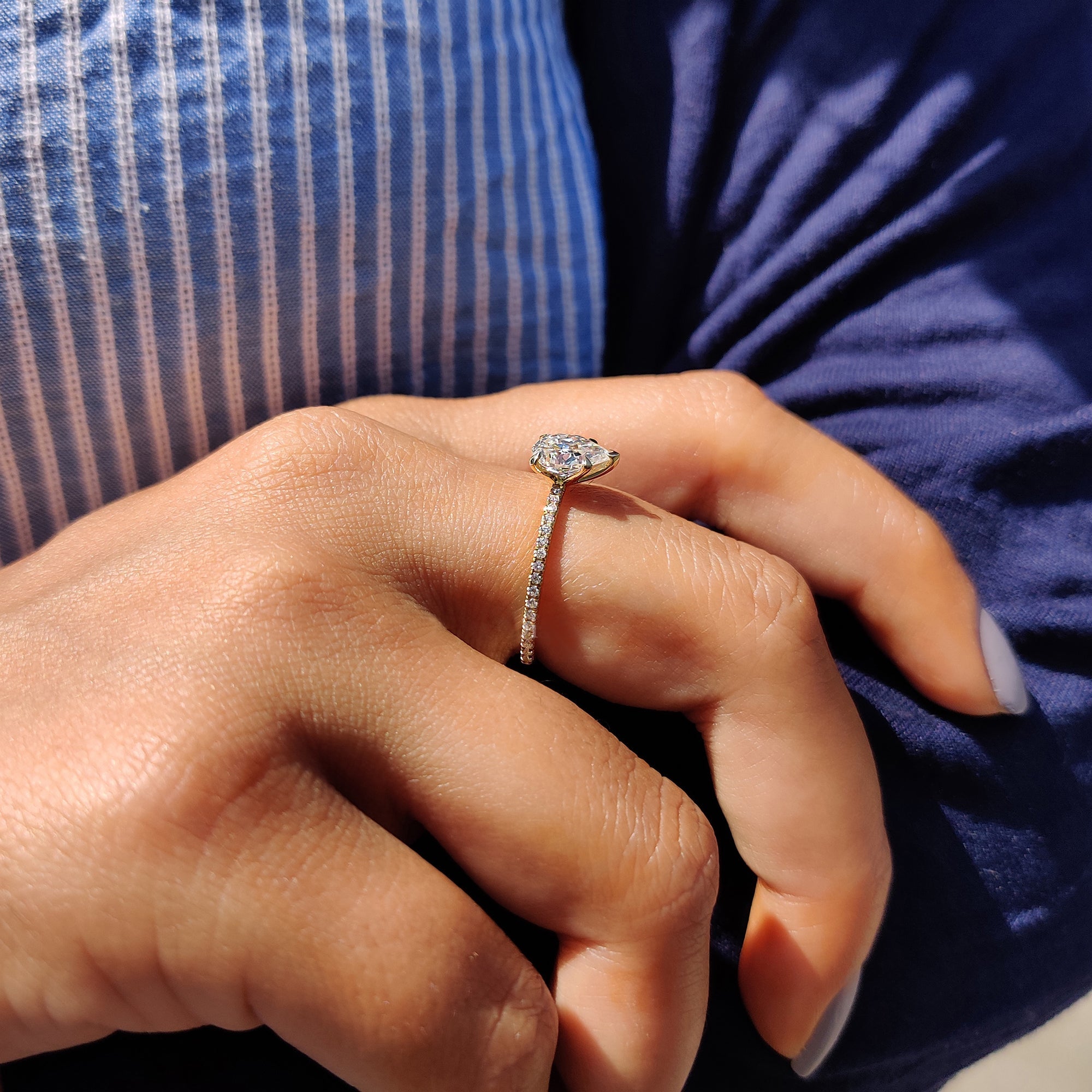 Pear Shaped Engagement Ring in Round Cut Pave Band