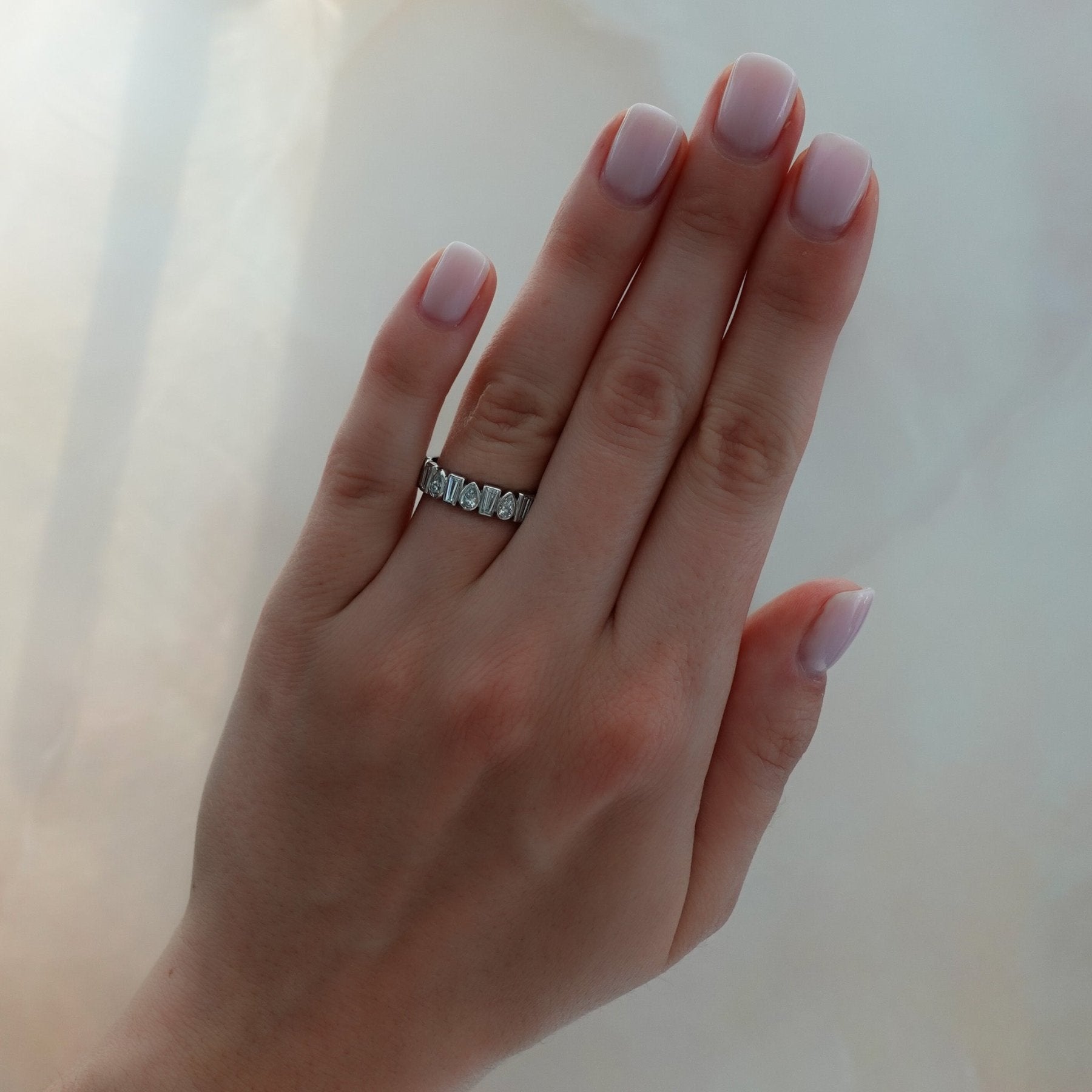 Baby Bezel Set Eternity Band with Pear and Tapered Baguette Diamonds Secondary image