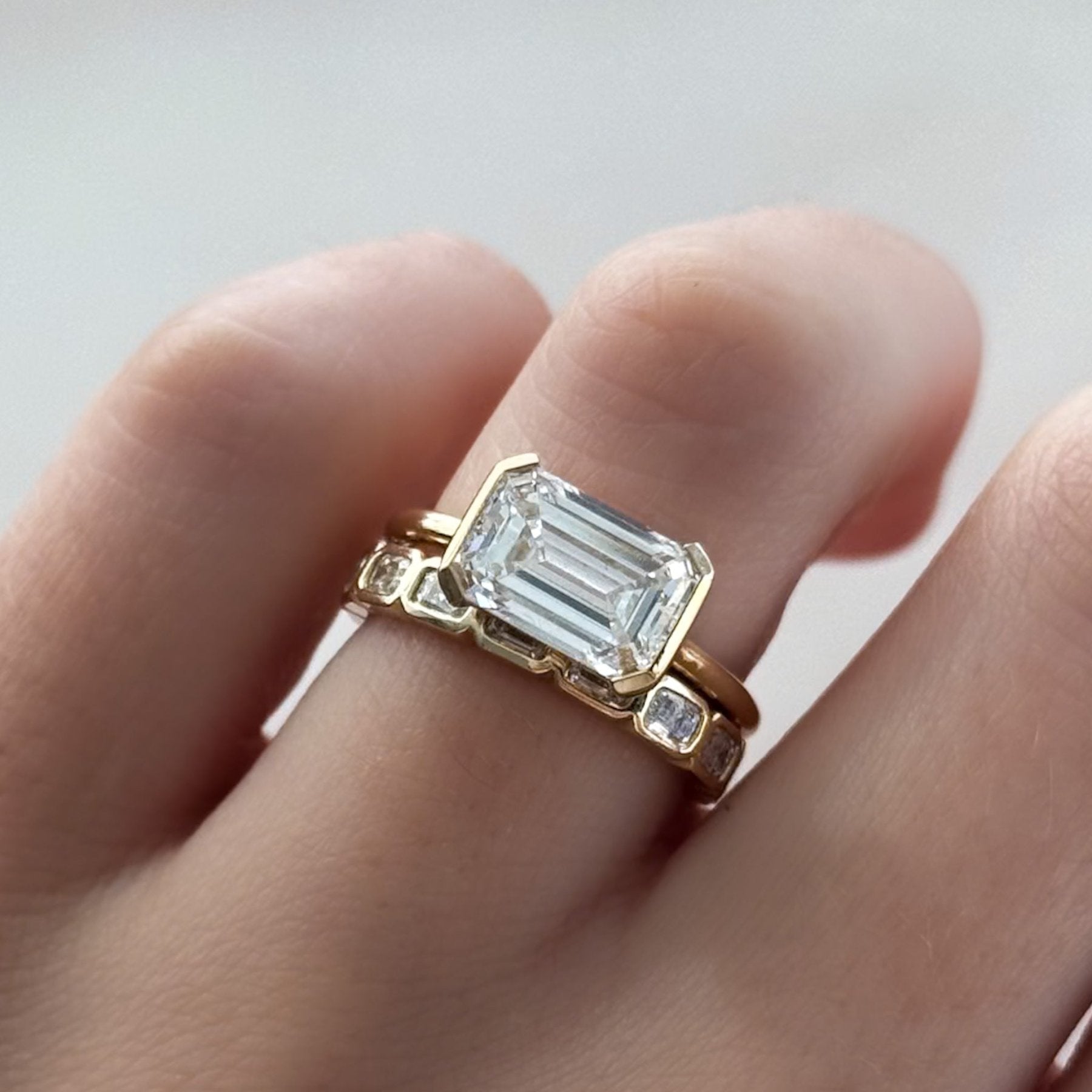 Baby Bezel Set Halfway Wedding Band With East West Emerald Cuts