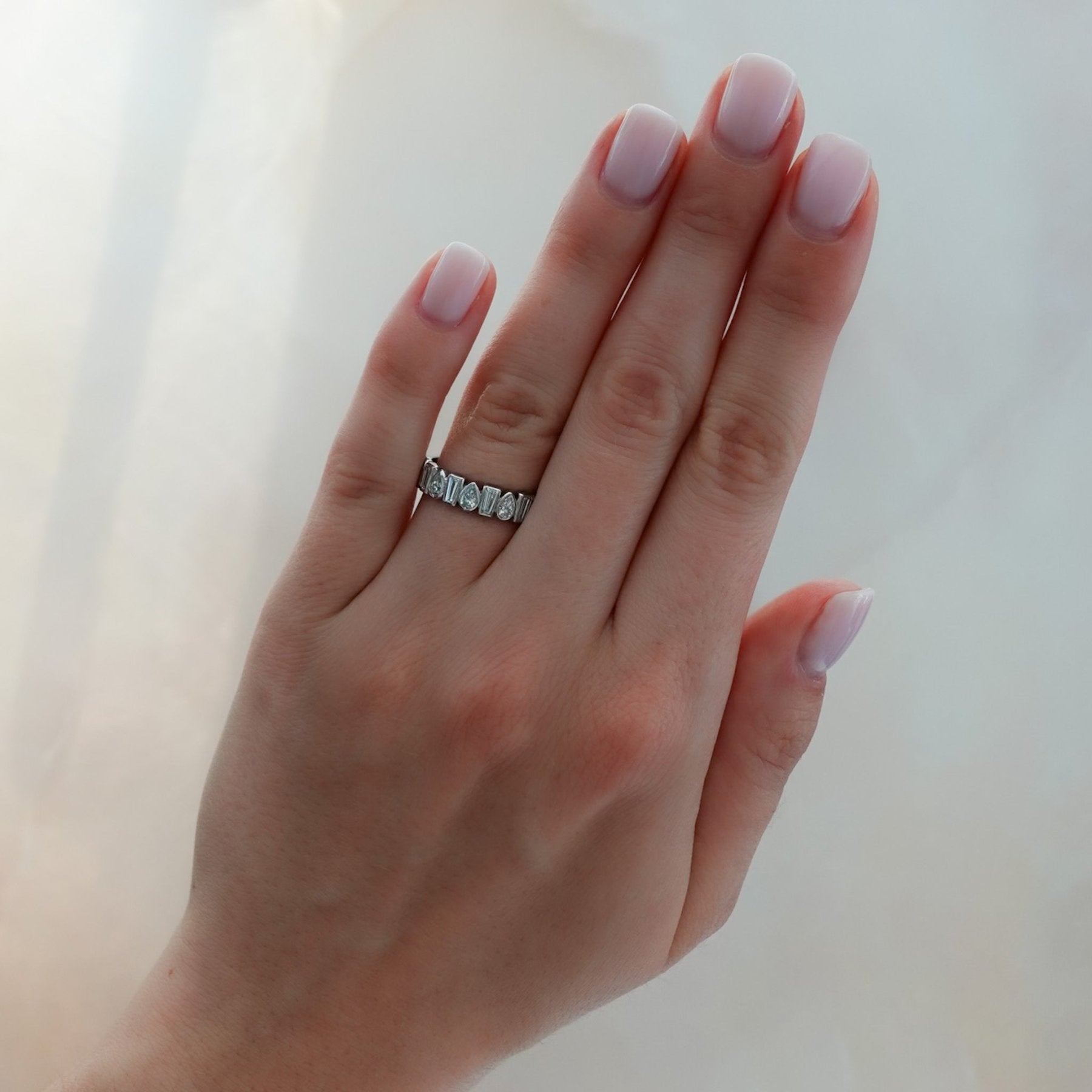 Baby Bezel Set Halfway Wedding Band with Pear and Tapered Baguette Diamonds Secondary image