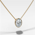 Bezel Pendant Necklace with an Oval Cut Diamond