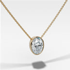 Bezel Pendant Necklace with an Oval Cut Diamond