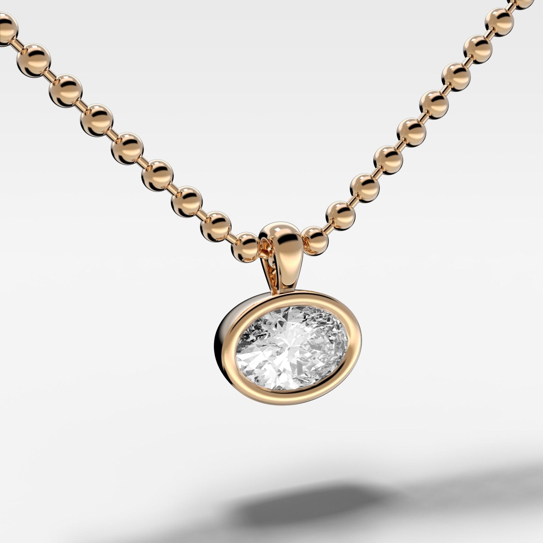 Bezel Set Pendant Beaded Necklace with East West Oval Cut Diamond
