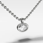 Bezel Set Pendant Beaded Necklace with East West Oval Cut Diamond