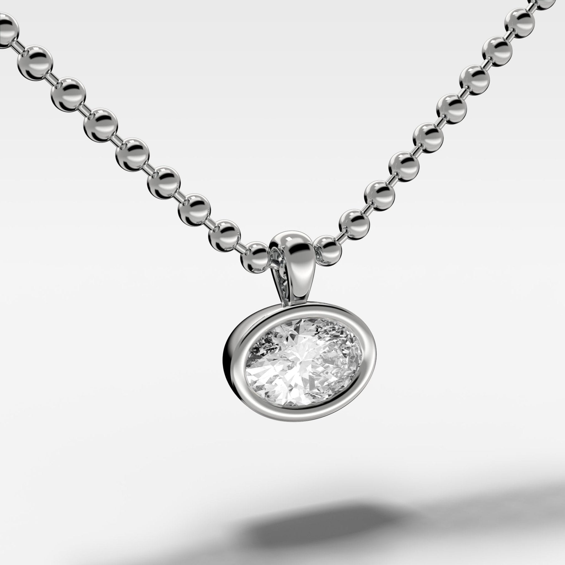 Bezel Set Pendant Beaded Necklace with East West Oval Cut Diamond