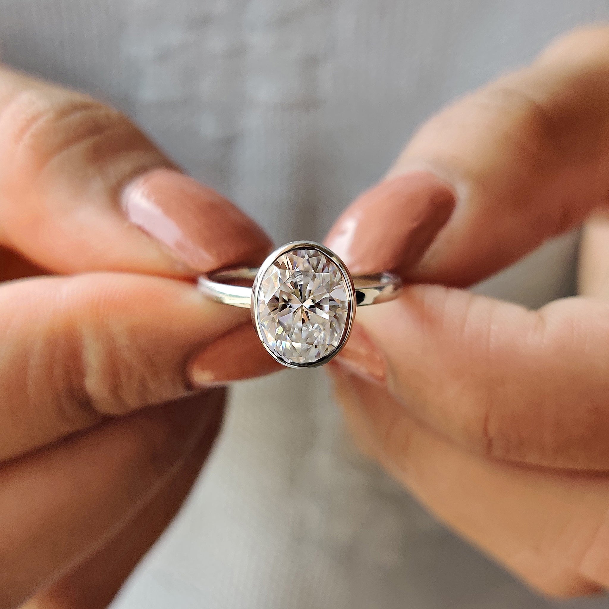 Oval Bezel Engagement Ring In Solitaire Style