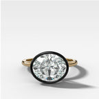 Blackened Penumbra Bezel Set Engagement Ring With East West Oval Cut