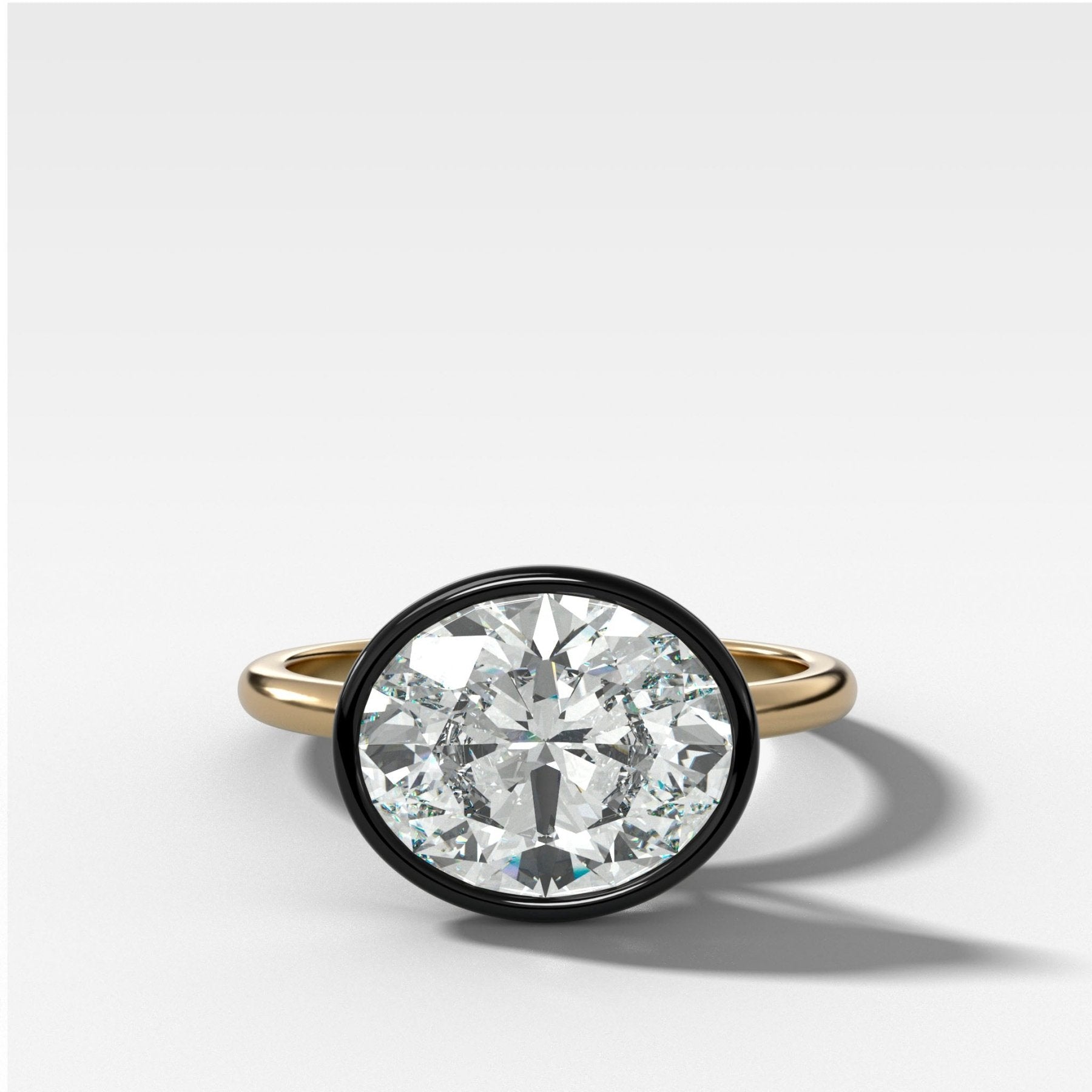 Blackened Penumbra Bezel Set Engagement Ring With East West Oval Cut