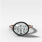 Blackened Penumbra Bezel Set Engagement Ring With East West Oval Cut