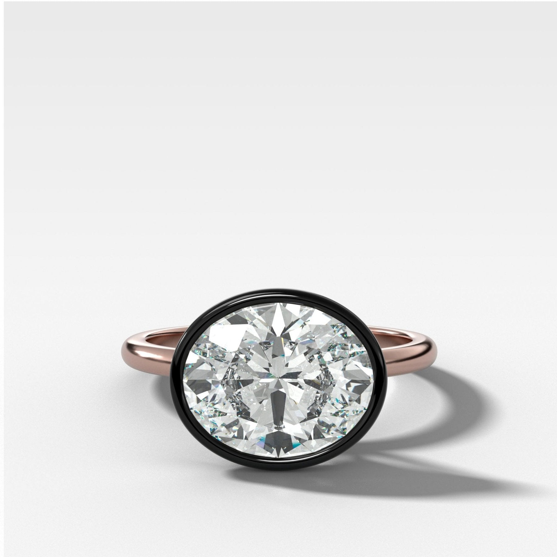 Blackened Penumbra Bezel Set Engagement Ring With East West Oval Cut