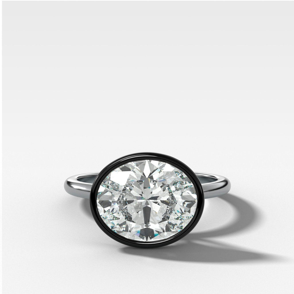 Blackened Penumbra Bezel Set Engagement Ring With East West Oval Cut