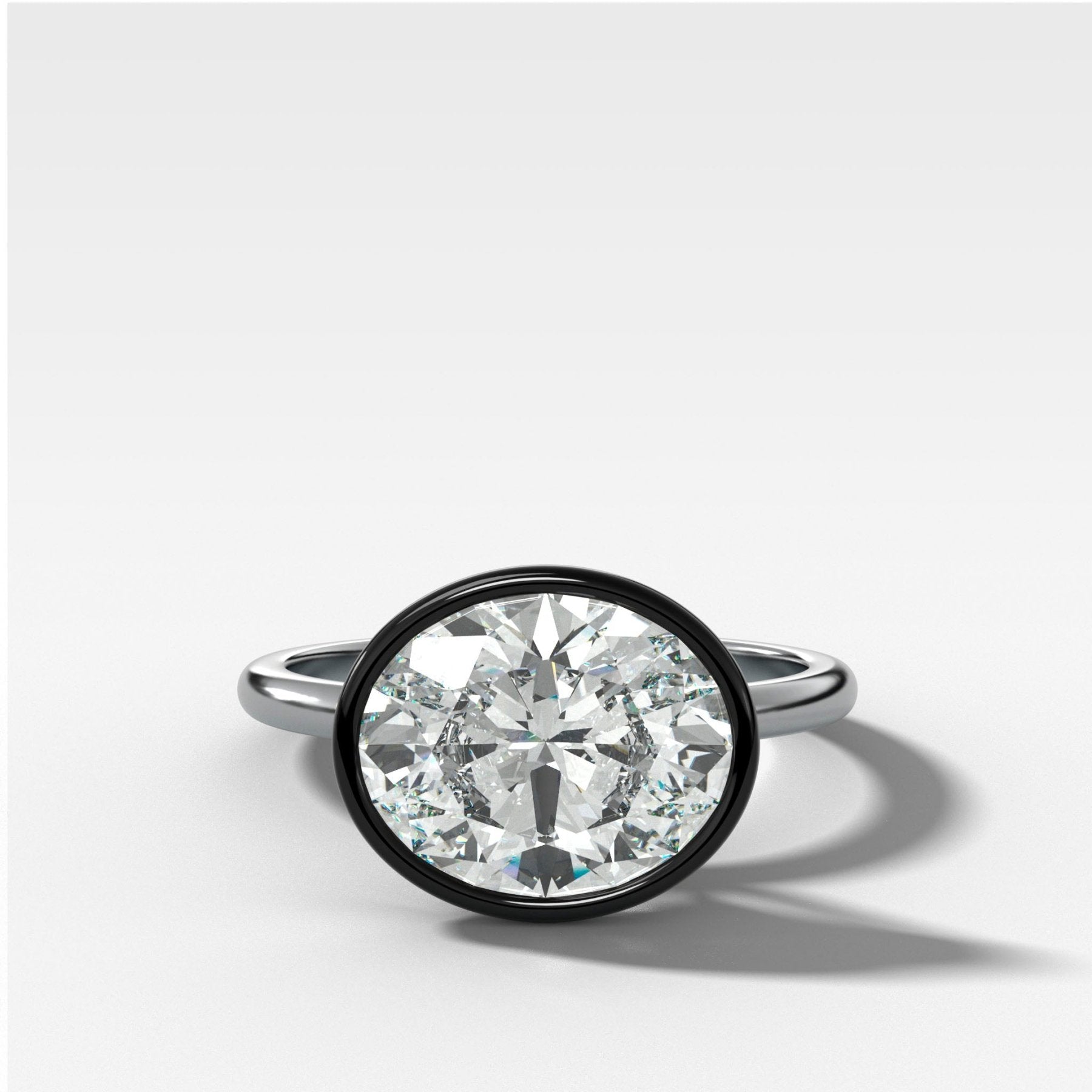 Blackened Penumbra Bezel Set Engagement Ring With East West Oval Cut