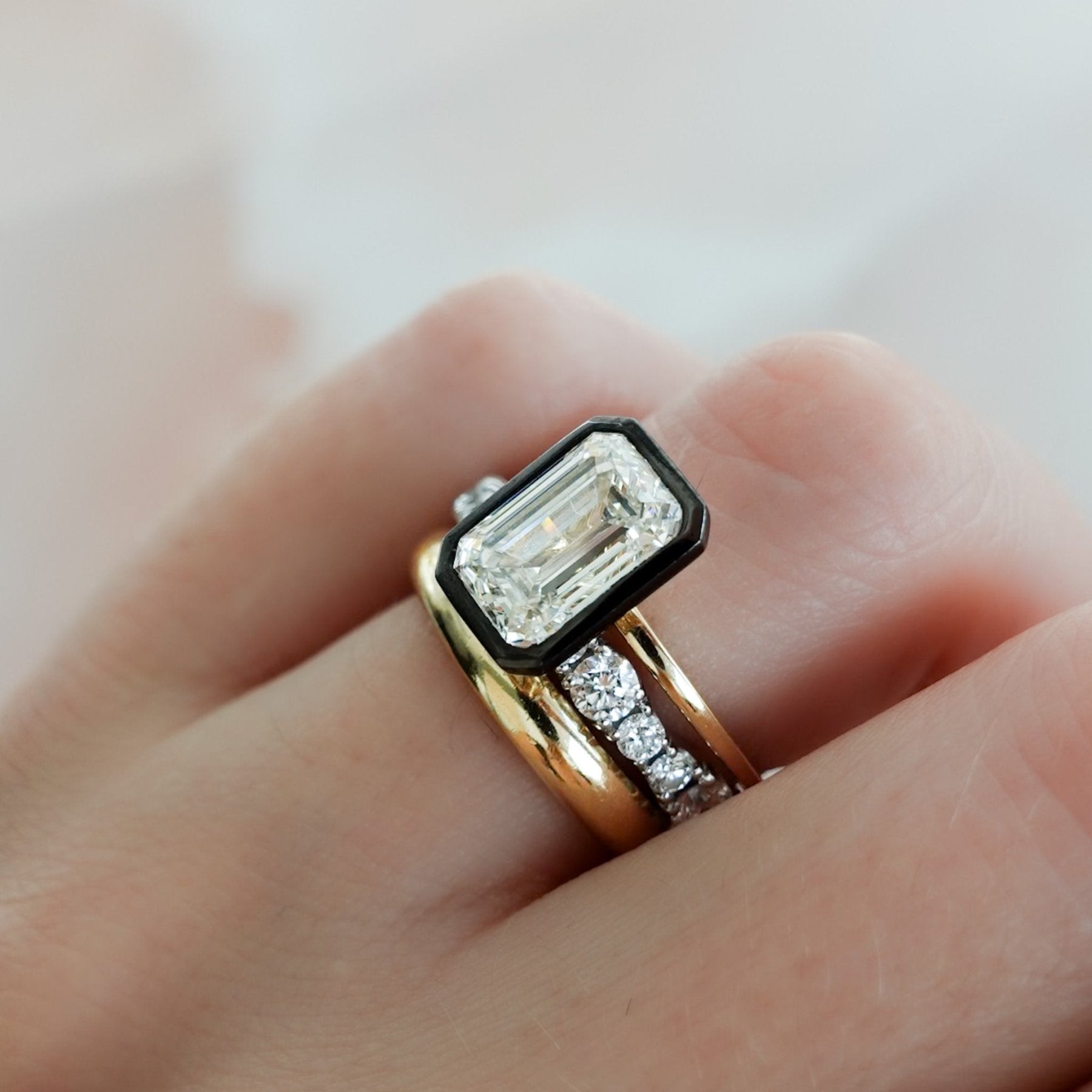 Blackened Penumbra Bezel Set Engagement Ring With Emerald Cut