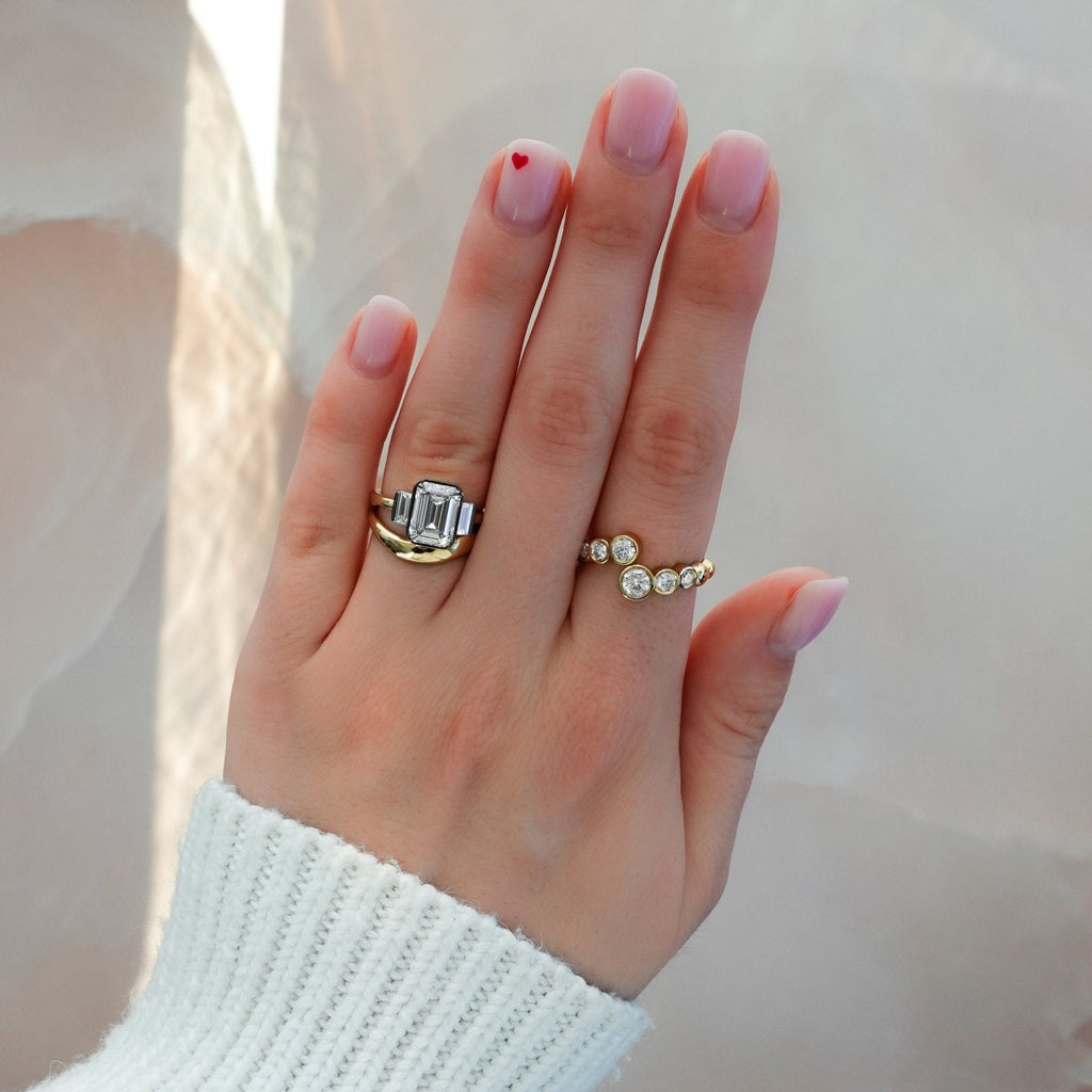 Blackened Three Stone Engagement Ring With Straight Baguette Side Stones and Emerald Cut Diamond