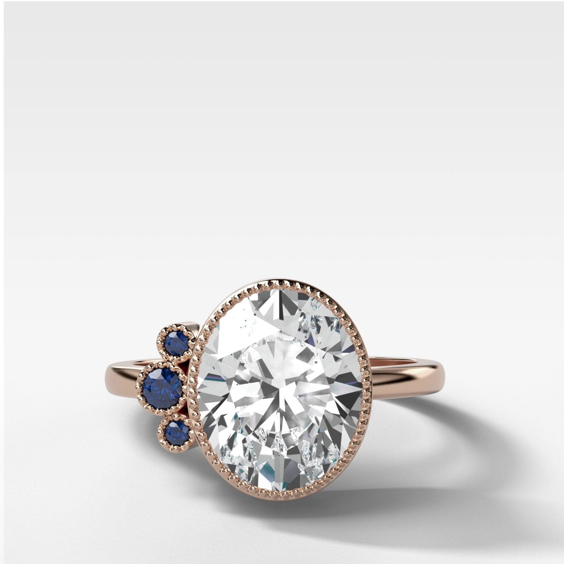 Blue Sapphire Cluster Engagement Ring With Oval Cut