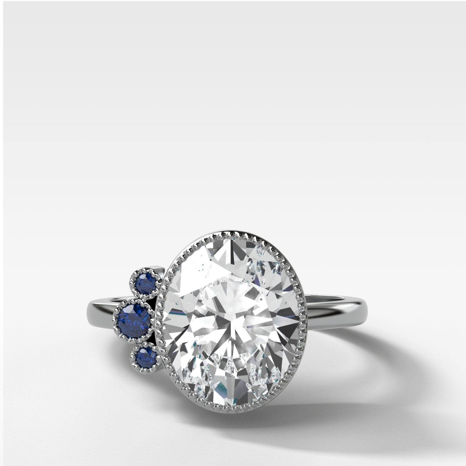 Blue Sapphire Cluster Engagement Ring With Oval Cut