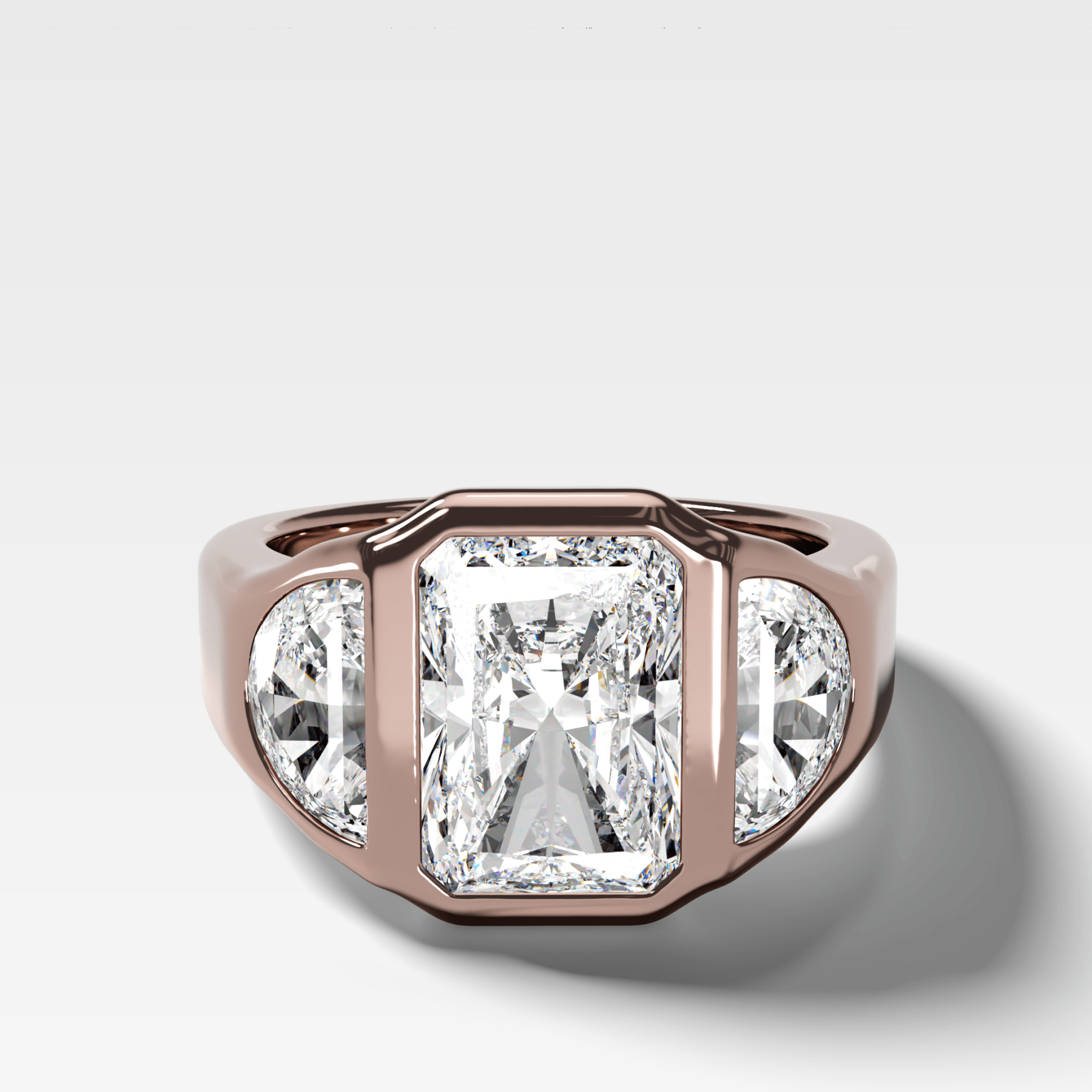 Burnished Three Stone Engagement Ring with Half Moon Sides and an Elongated Radiant Cut Diamond