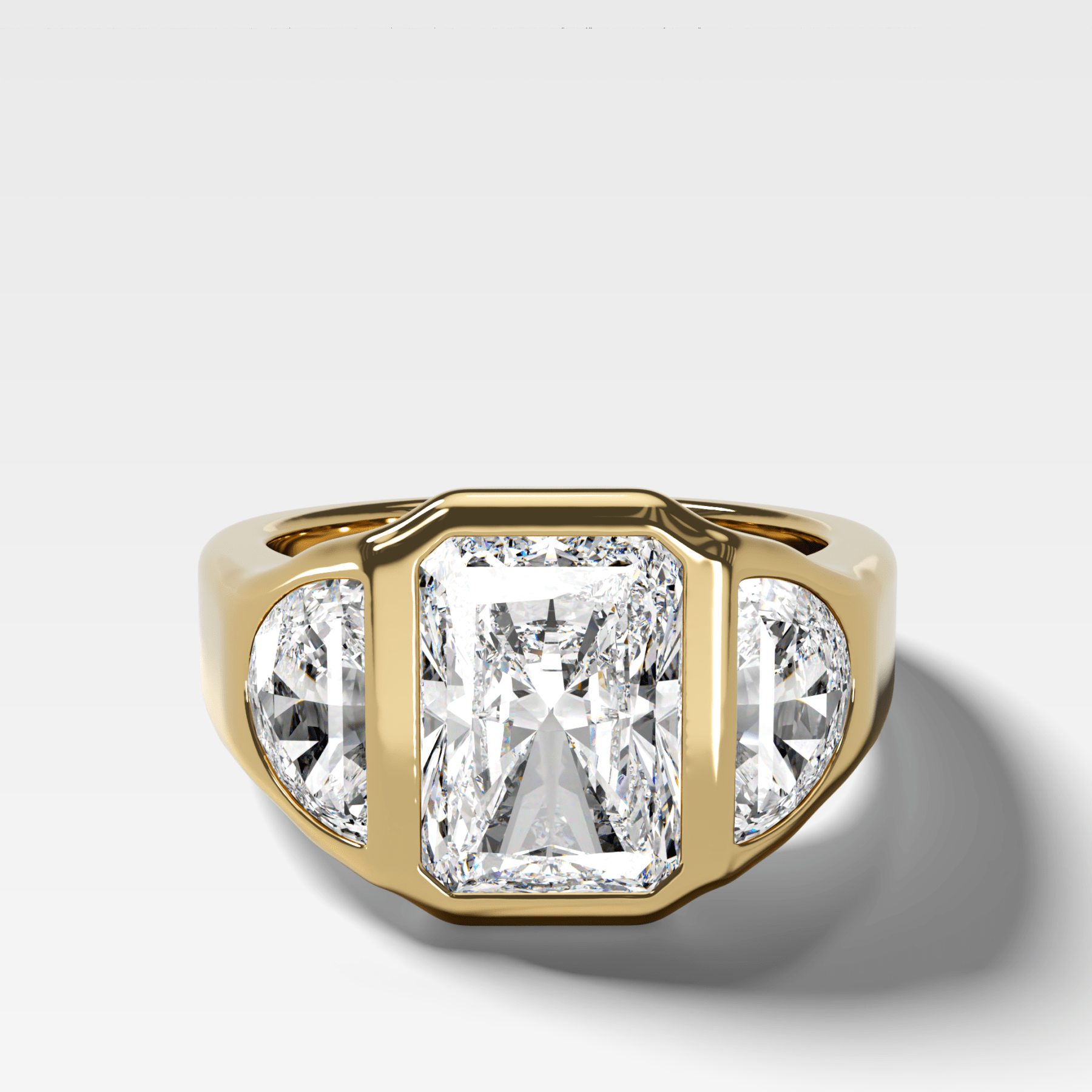 Burnished Three Stone Engagement Ring with Half Moon Sides and an Elongated Radiant Cut Diamond Main image
