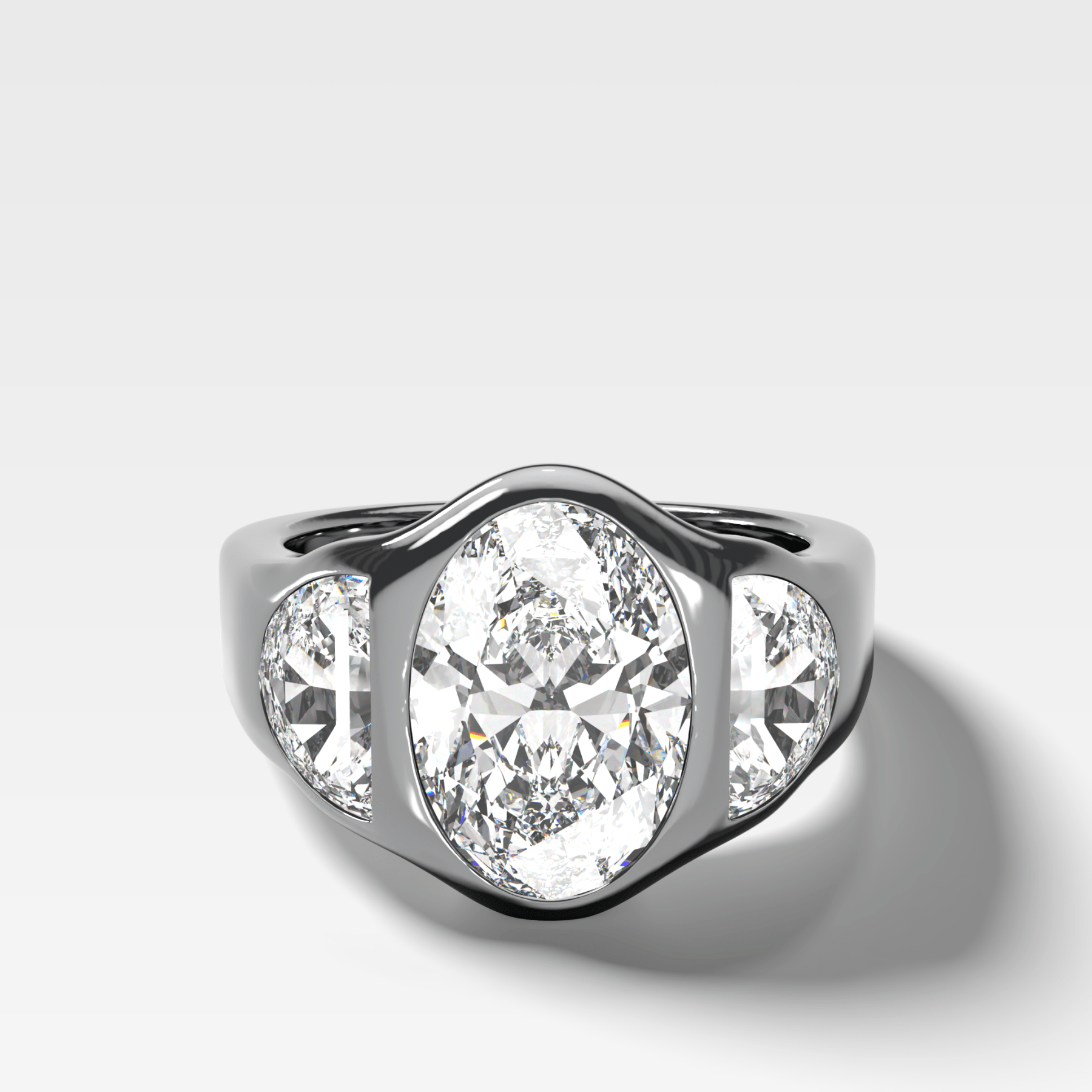 Burnished Three Stone Engagement Ring with Half Moon Sides & Oval Cut Diamond