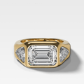 Burnished Three Stone Engagement Ring with Trilliant Sides and East West Emerald Cut Diamond