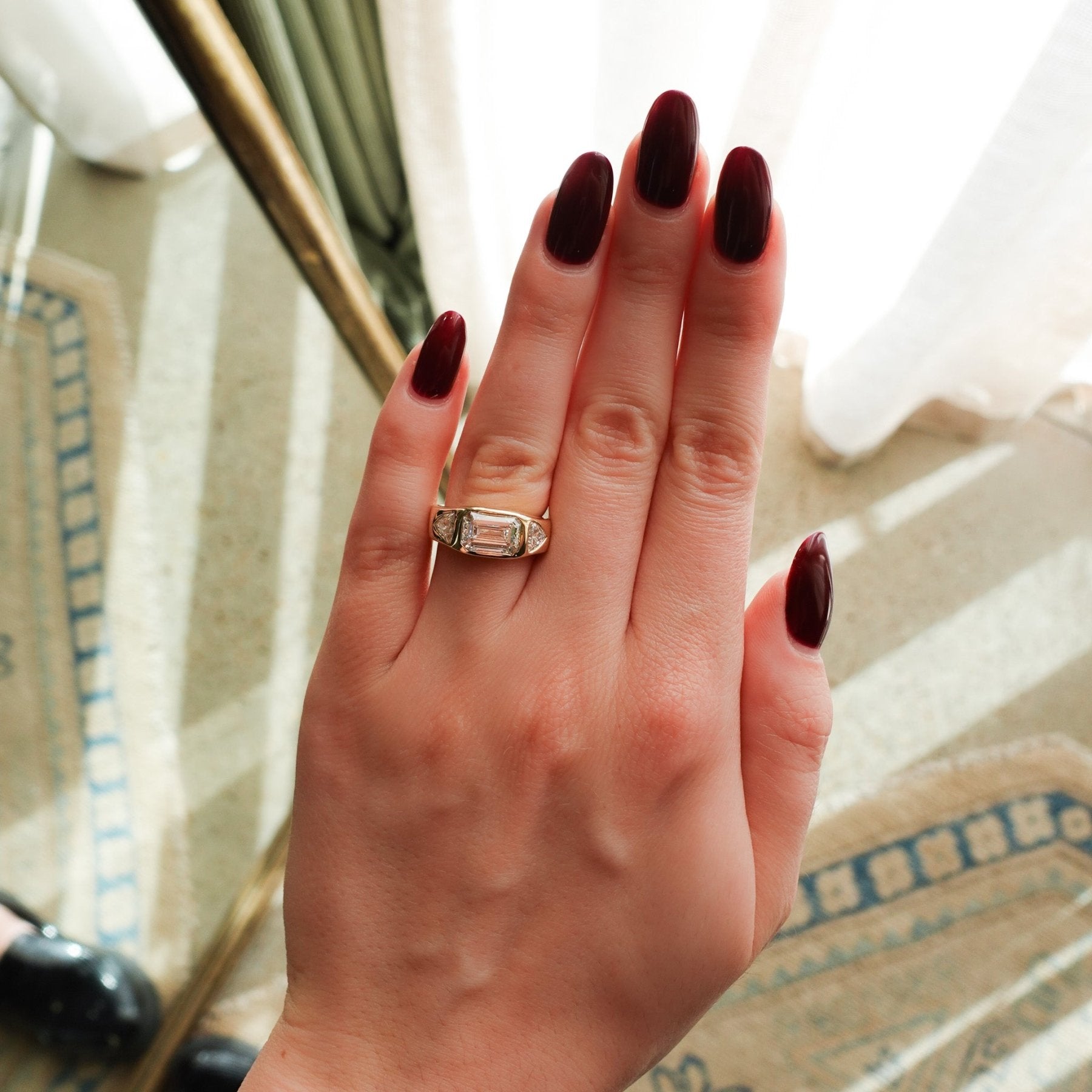 Burnished Three Stone Engagement Ring with Trilliant Sides and East West 2.53ct  Lab Grown Emerald Cut Diamond