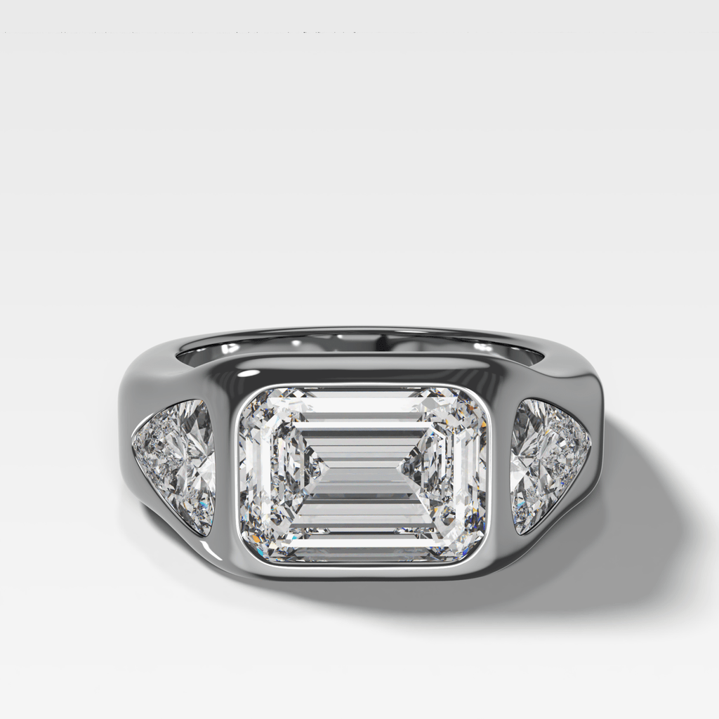 Burnished Three Stone Engagement Ring with Trilliant Sides and East West Emerald Cut Diamond