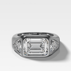 Burnished Three Stone Engagement Ring with Trilliant Sides and East West Emerald Cut Diamond