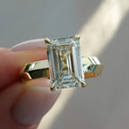 Butter Knife Solitaire Engagement Ring With Emerald Cut Diamond