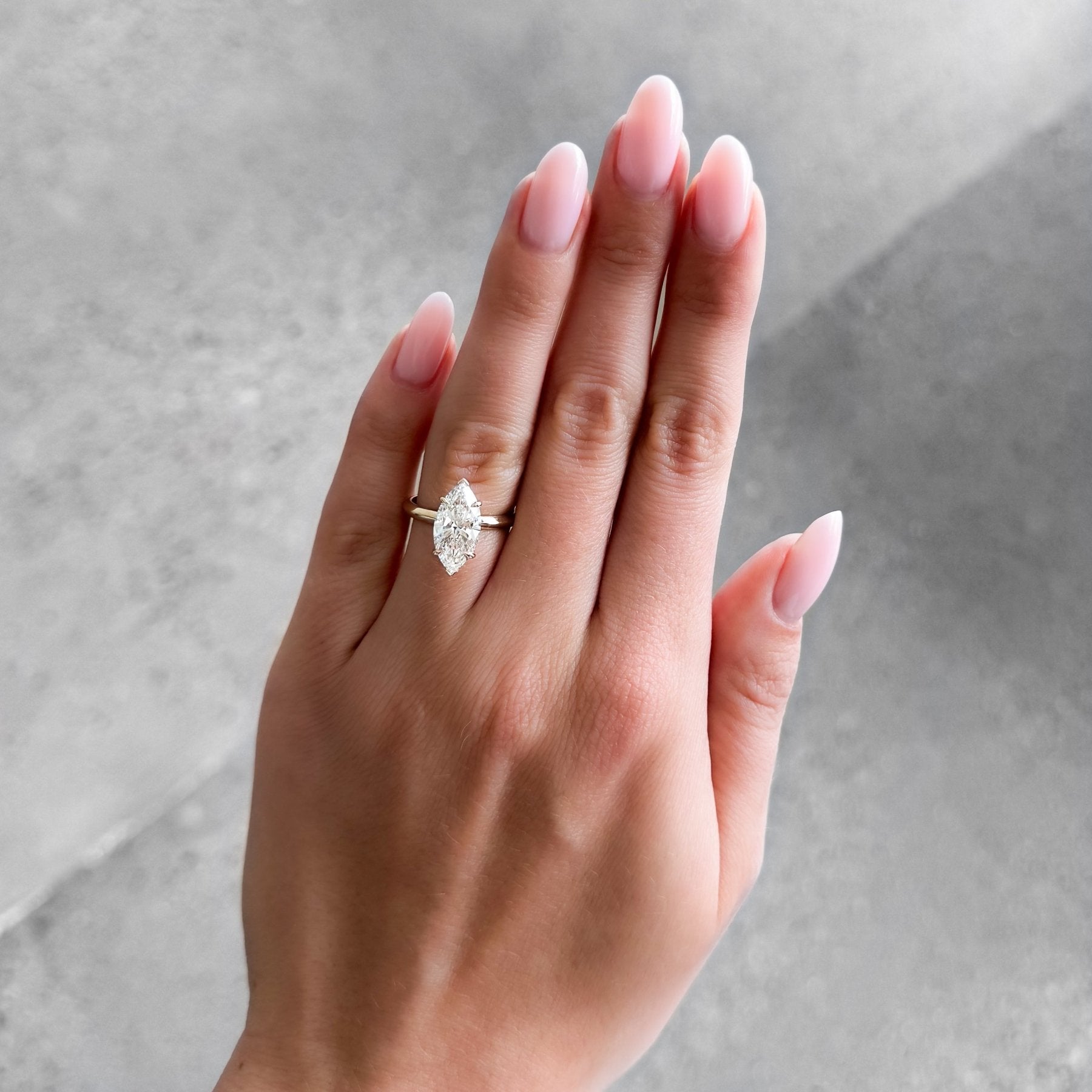 Butter Knife Solitaire Engagement Ring With Marquise Cut Diamond
