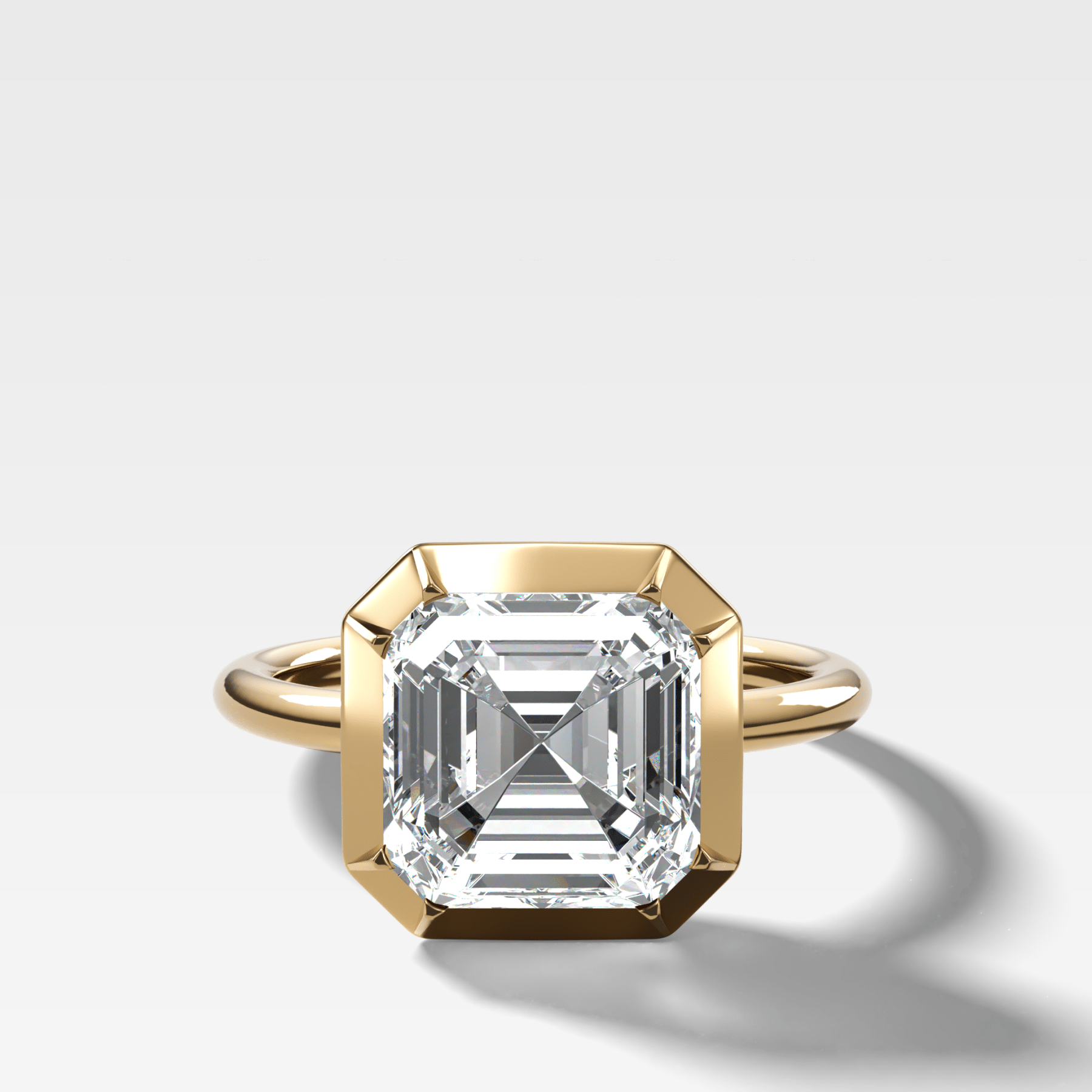 Button Back Solitaire Engagement Ring With an Asscher Cut Diamond