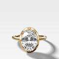 Button Back Solitaire Engagement Ring With an Oval Cut Diamond